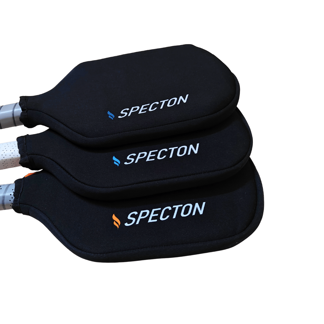 Stacked Specton pickleball paddle covers showing protective fabric and logo branding