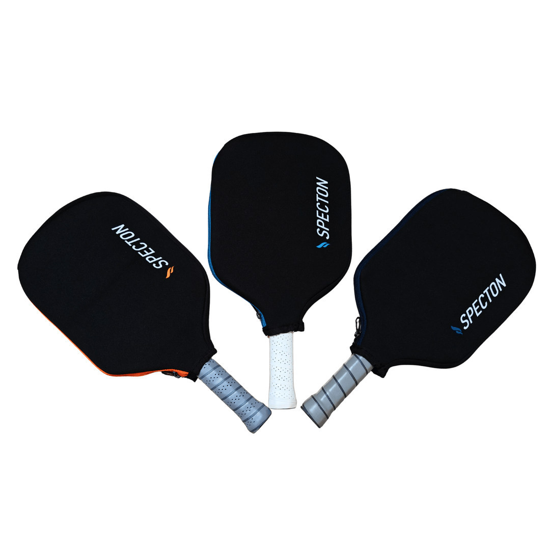 Three Specton pickleball paddle covers in orange, blue and navy blue colours