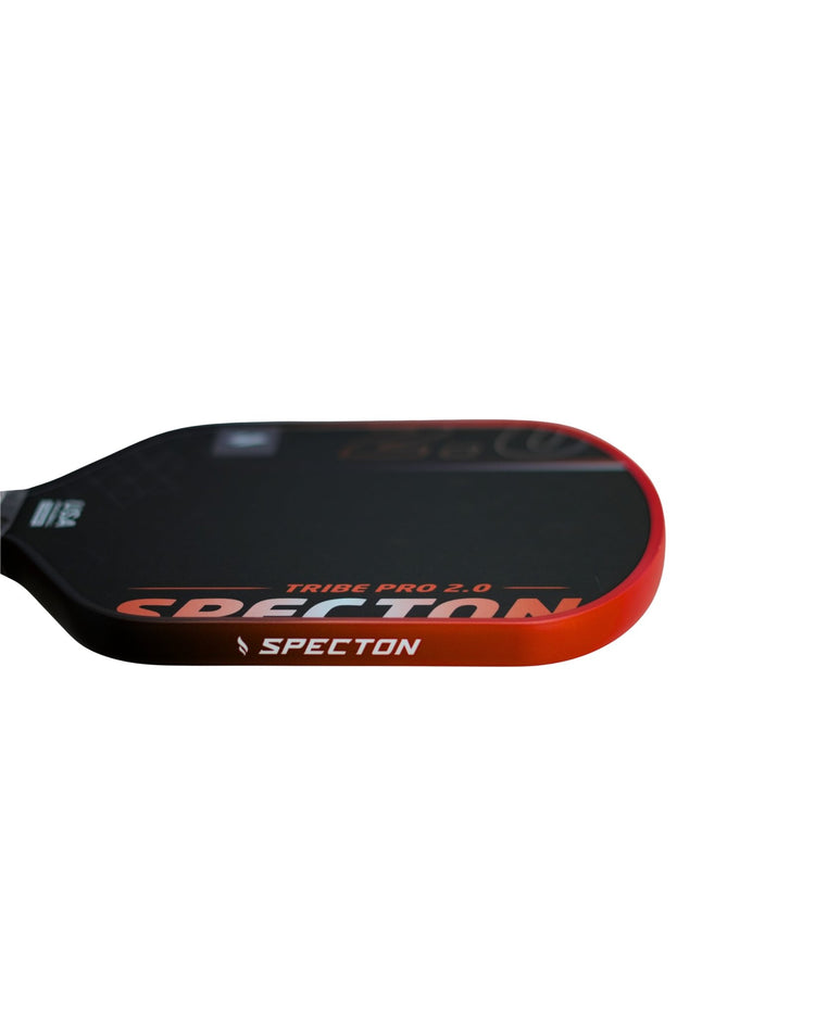 Side profile of Specton Tribe Pro 2.0 pickleball paddle with vibrant orange edge guard